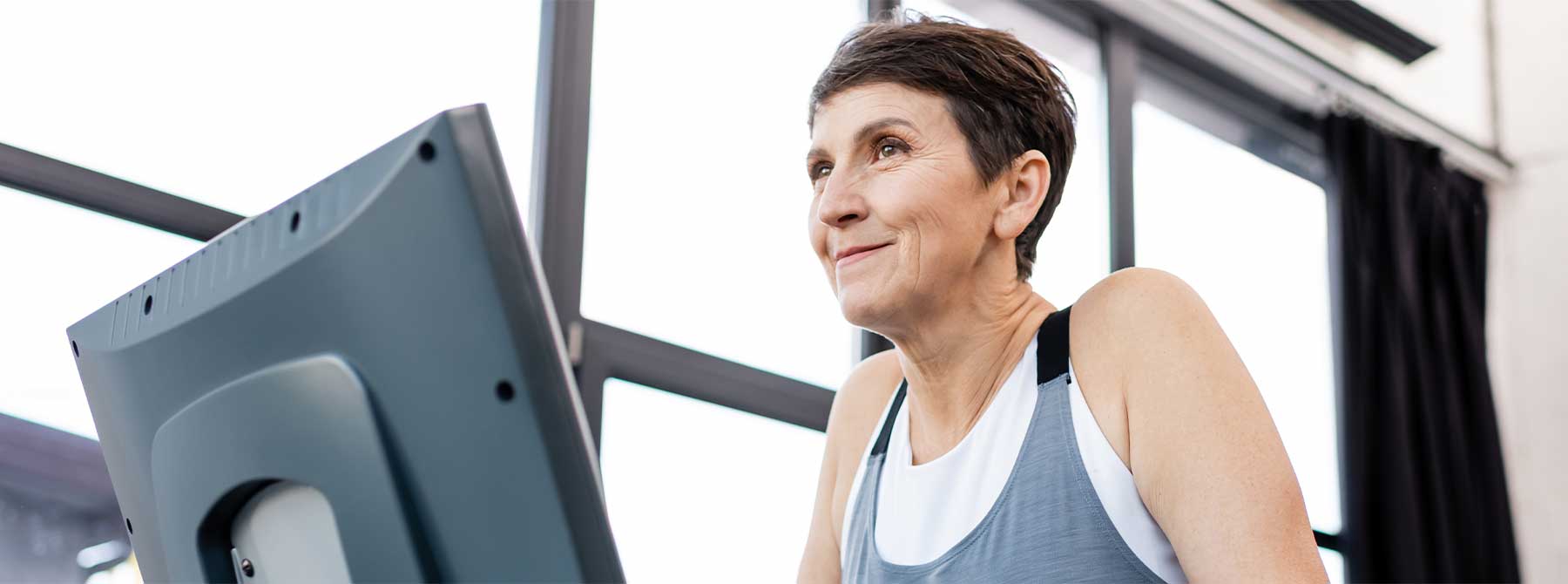 woman on treadmill after minimally invasive spine surgery