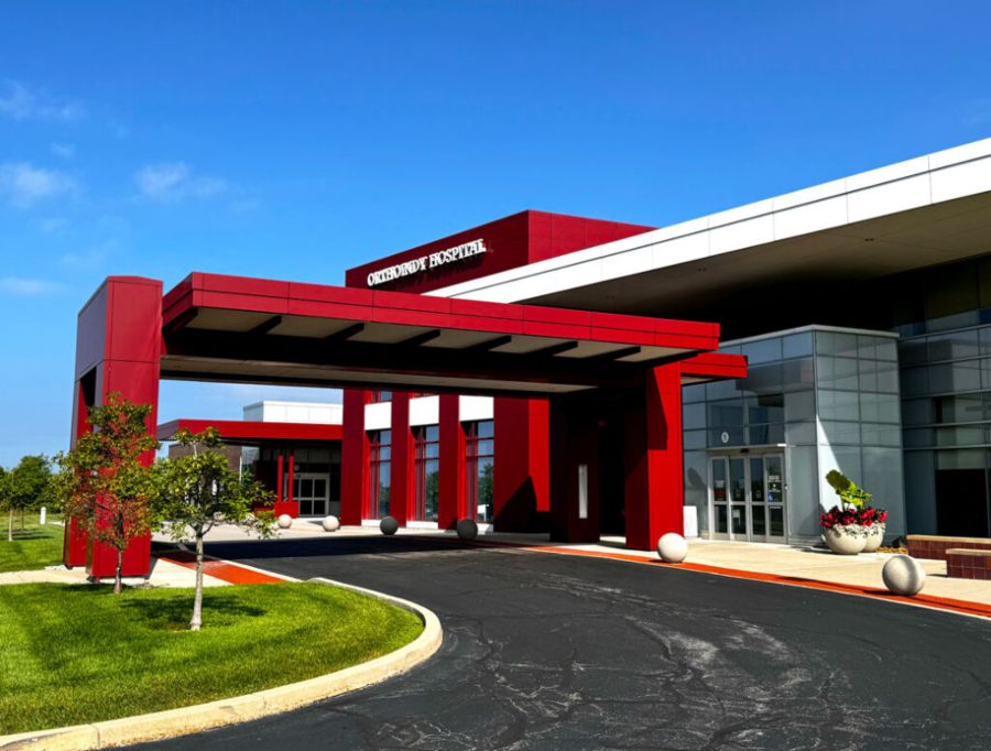 Modern hospital building with bold red entrance structure in Brownsburg, IN